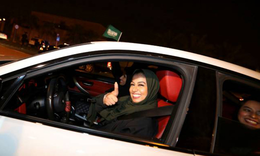 women driving car